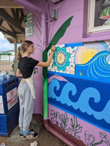 Kapa'a high school student painting a mural