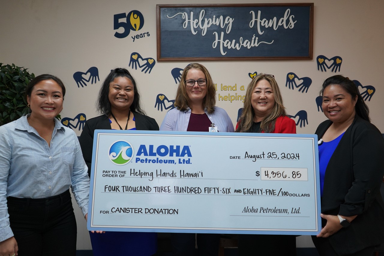 Aloha Gas representatives present a check to Helping Hands Hawai'i