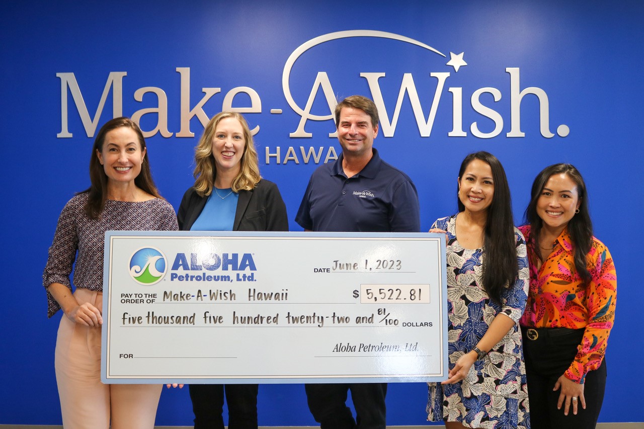 Aloha Petroleum representatives present check to Make-A-Wish representatives.