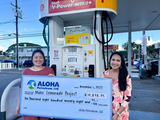 Aloha Petroleum representatives present check to Make Lemonade Project.