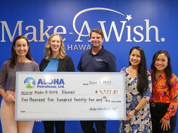 Aloha Petroleum representatives present check to Make-A-Wish representatives.