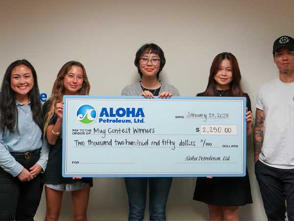 Mug design contest winners presented with check